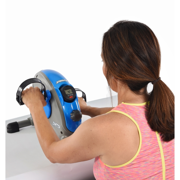 Woman workout on Blue Stamina Mini Exercise Bike with Smooth pedal System
