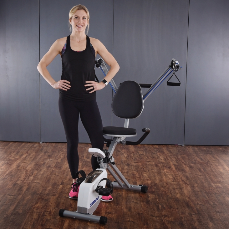 Woman standing beside the customize Stamina Exercise Bike.