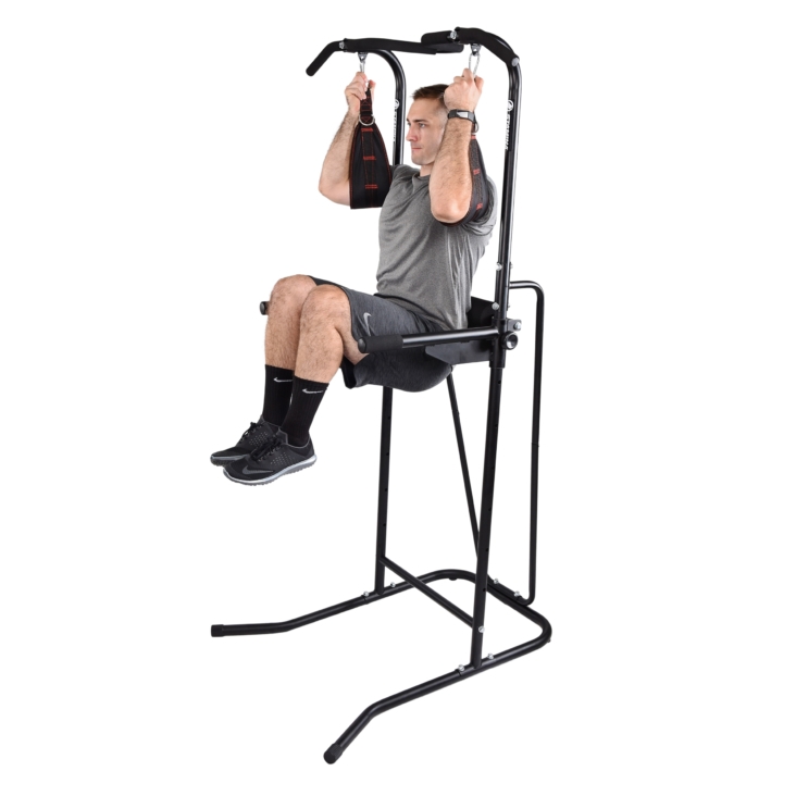 Man using arm straps on stamina power tower.