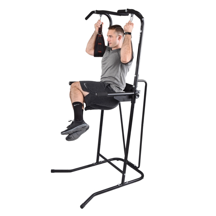 Man using arm straps on stamina power tower.